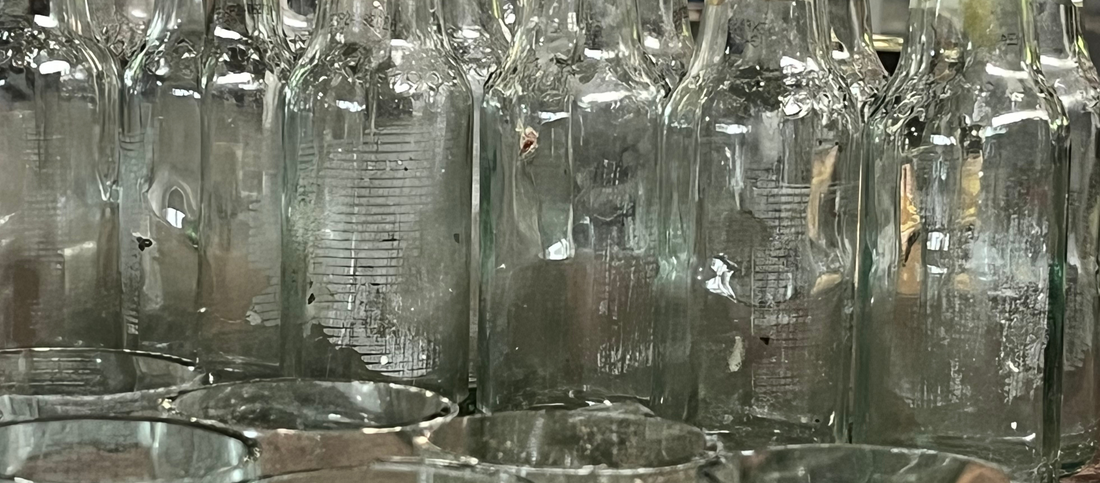 glass containers upcycled from discarded bottles destined for landfill